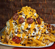Salchipapas are some of the most recognizable food that is the coastal version of fast food. A bed of french fries, sauces, and meats make this dish amazing.